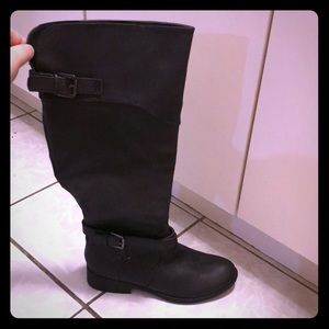 Tall black riding boots